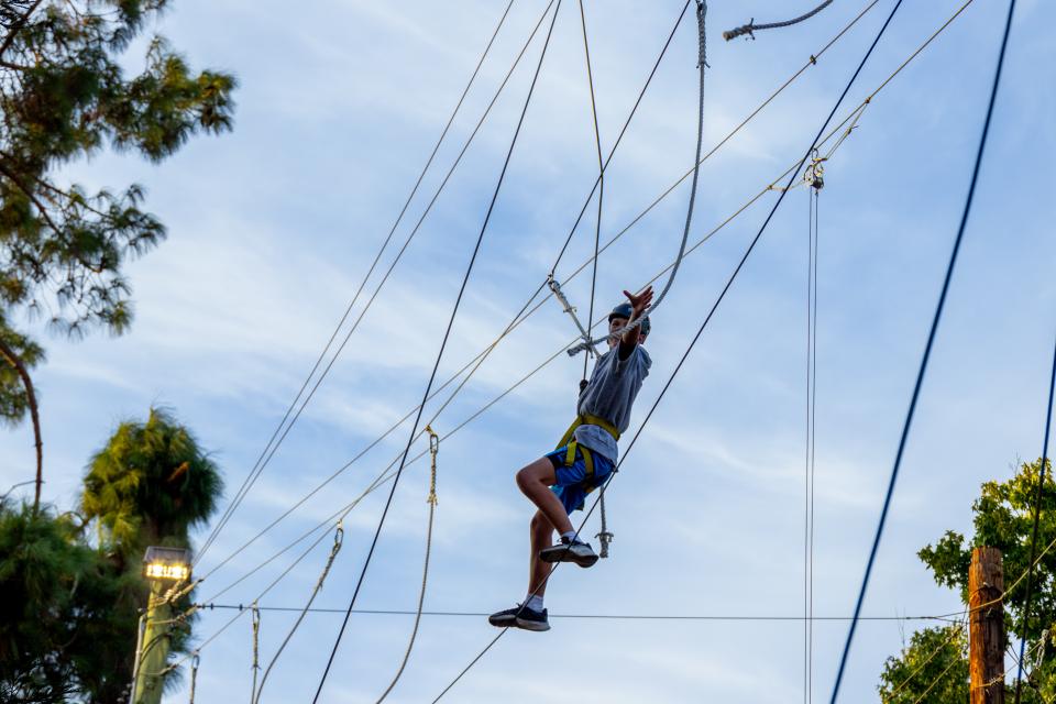 Student using the ropes course