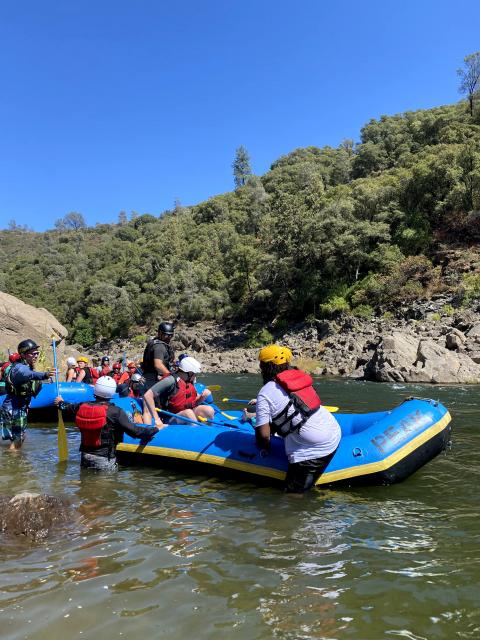 A blue raft on rafting on the south fork of the american river with Peak Adventures.