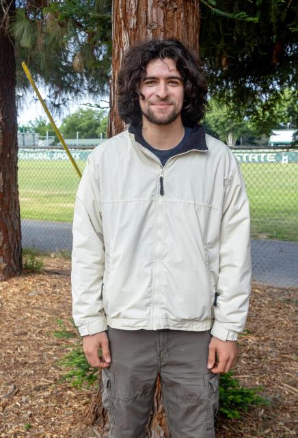 Garcia in front of tree
