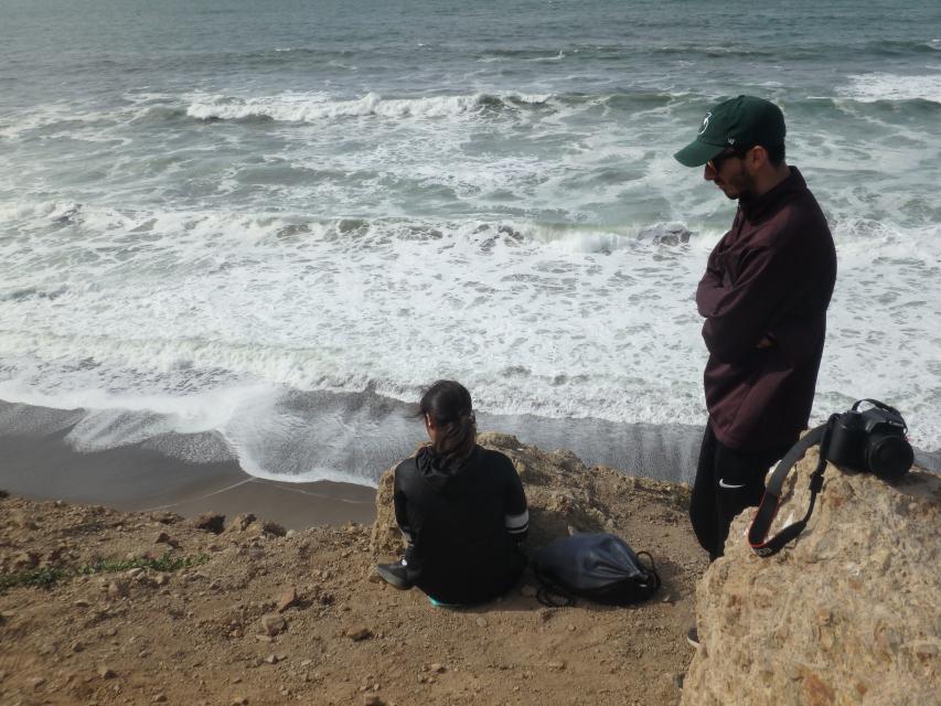 Particiants at the beach overlooking the ocean