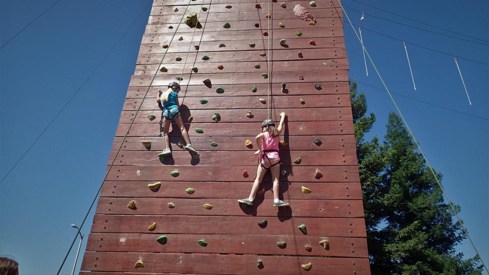 Kids climbing at the Challenge Center at Summer Camp 
