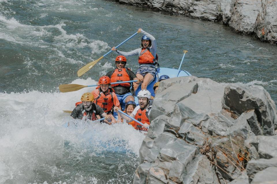 A blue raft on rafting on the south fork of the american river, near sacramento, with Peak Adventures.