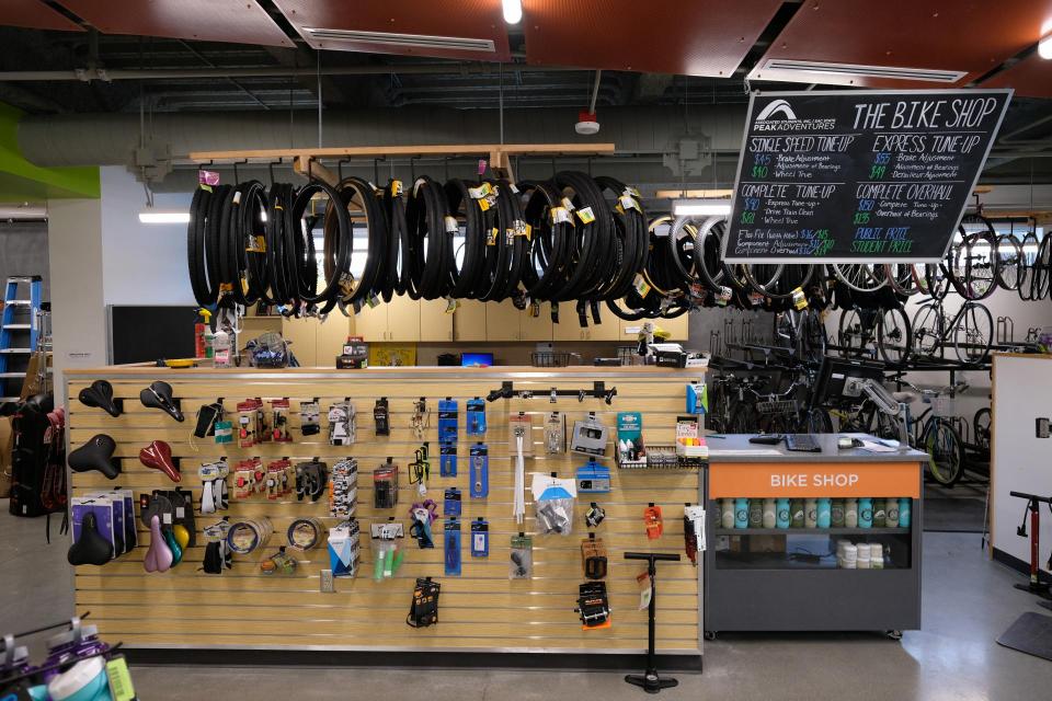 the peak adventures bike shop retail wall and cash register counter