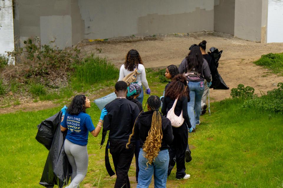 Caribbean Club doing river clean up