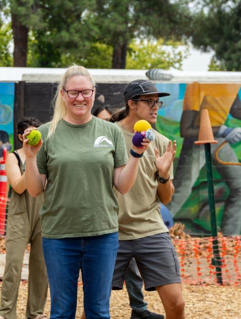Challenge Center Facilitators explaining a game to participants 