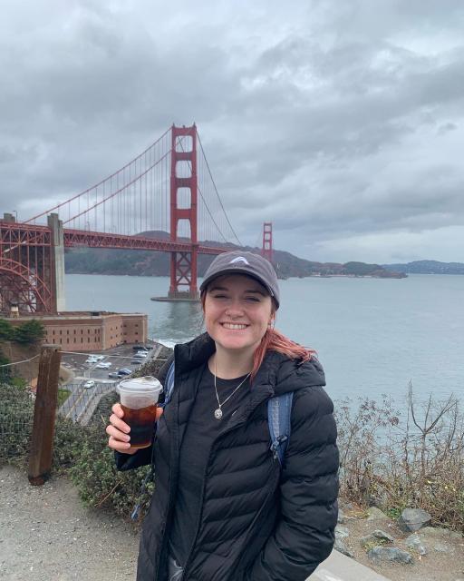 Elena Burge in front of the golden gate bridge