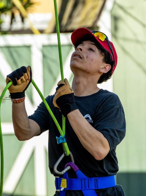 Isaiha belaying at the course