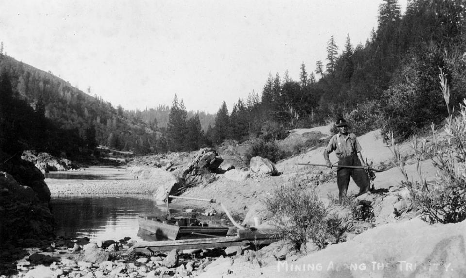 old photo of mining on the american river